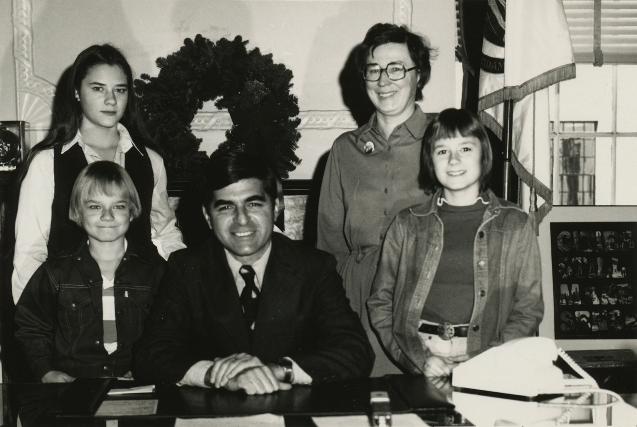 family posing with the Governor Dukakis in his office