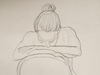 figure resting her face on her hands
