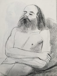 Charcoal on paper, 18"x24" charcoal drawing of a male figure with a beard reclining